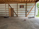 Indoor basketball and corn hole in the movie barn